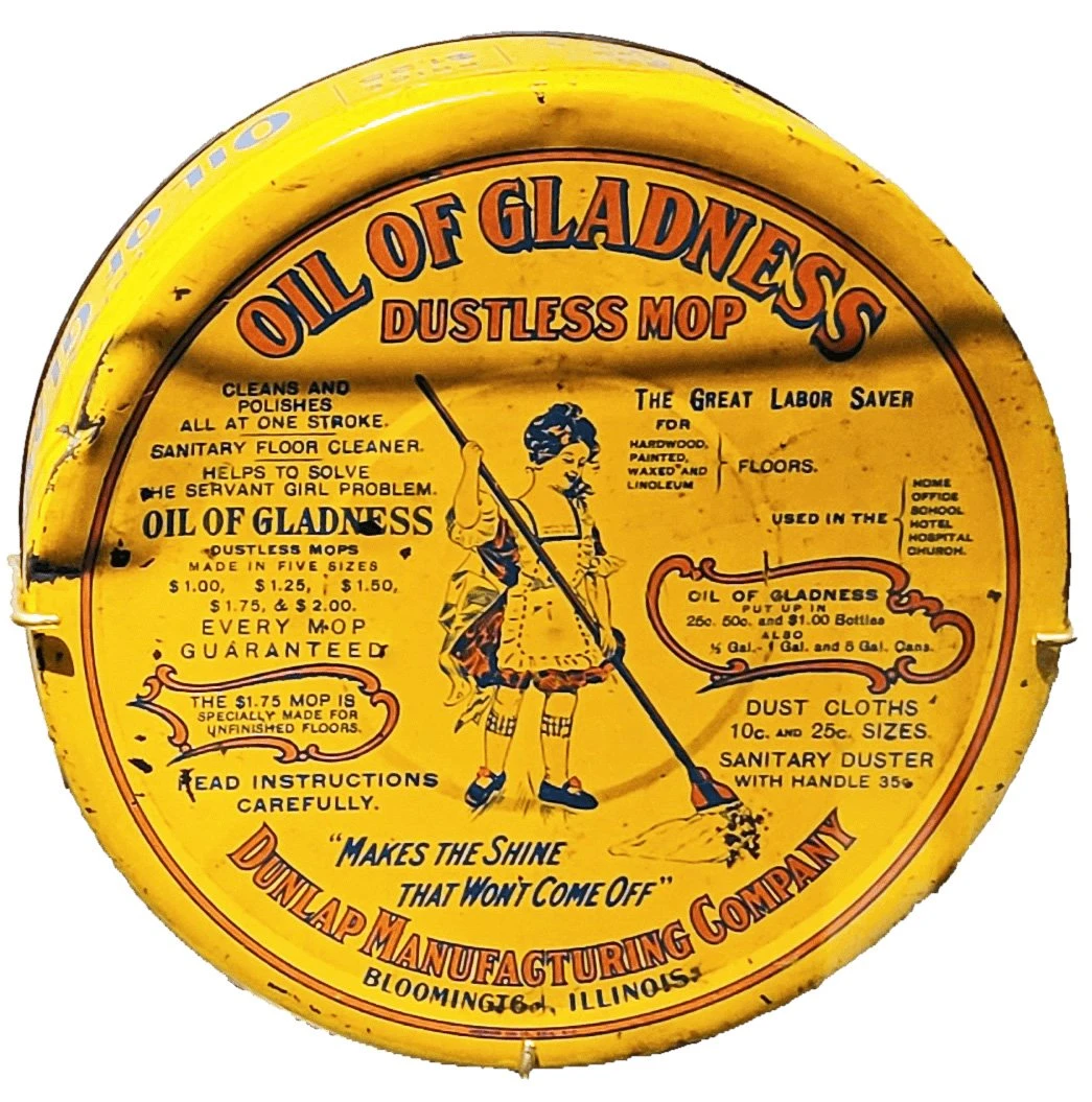 circular tin box with logo of girl mopping and text around the lid.
