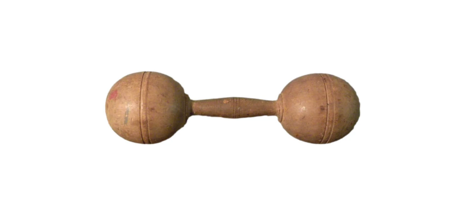 Wooden handle in between two wooden spheres.